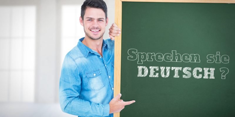 young-man-presenting-a-german-language-chalkboard-2026-04-13-23-08-14-utc